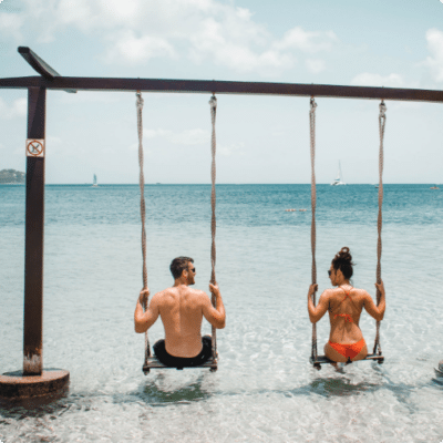 couple on swing in ocean, Live Auction Fundraising