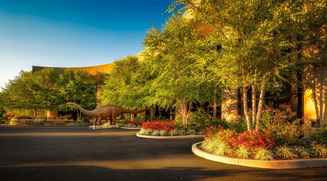 Statue of dinosaur in parking lot, Live Auction Fundraising