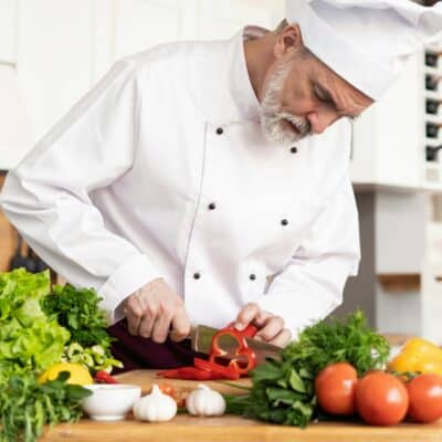 Chef cutting vegetables, vacation fundraising, fundraising ideas, charity ideas, silent auction items, travel fundraising events