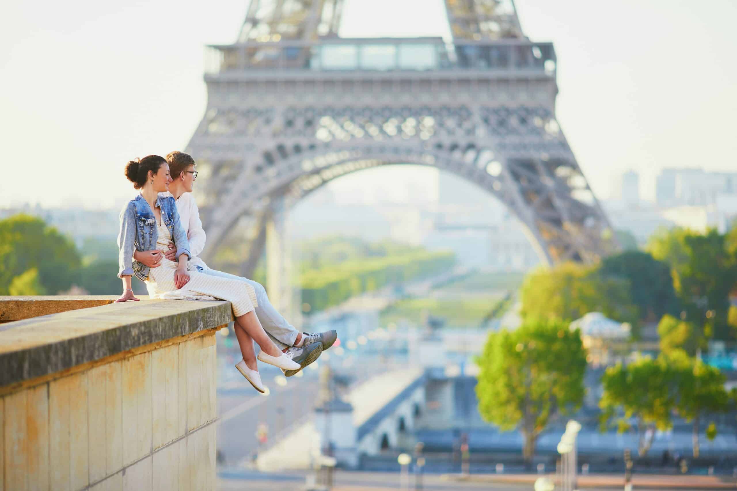 Couple sitting in Paris, vacation fundraising, fundraising ideas, charity ideas, silent auction items, travel fundraising events