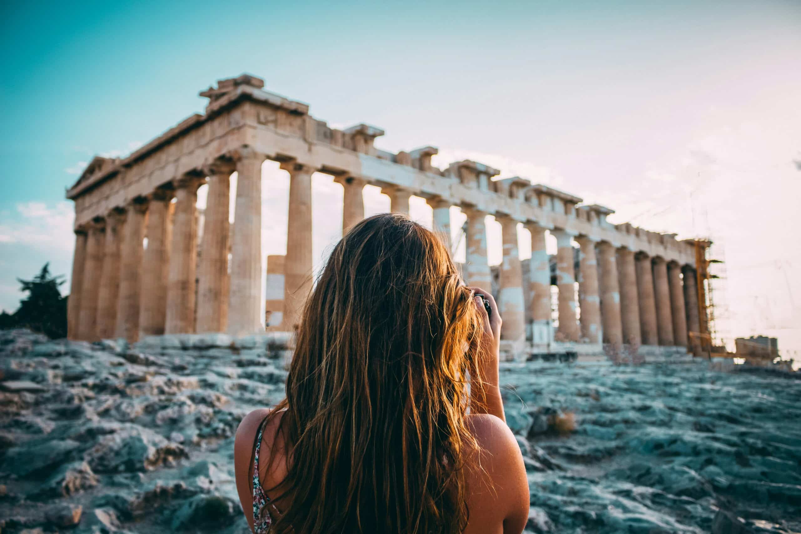 person taking picture of Athens ruins, charity auction travel packages, vacation fundraising, travel fundraising, fundraising ideas, charity ideas, silent auction items, travel fundraising events
