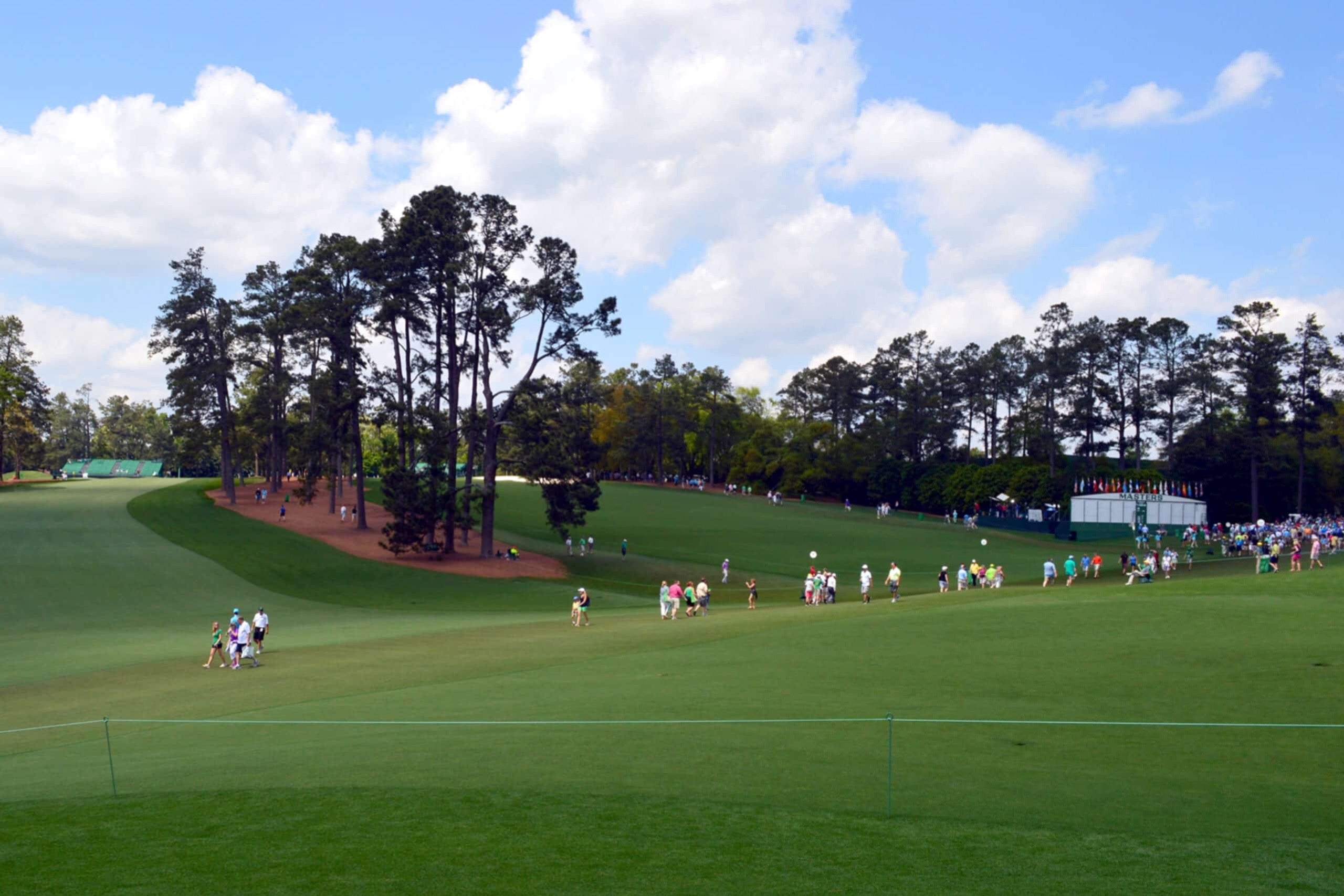 People standing on golf course, consignment travel providers, charity auction travel packages, vacation fundraising, travel fundraising, fundraising ideas, charity ideas, silent auction items, travel fundraising events