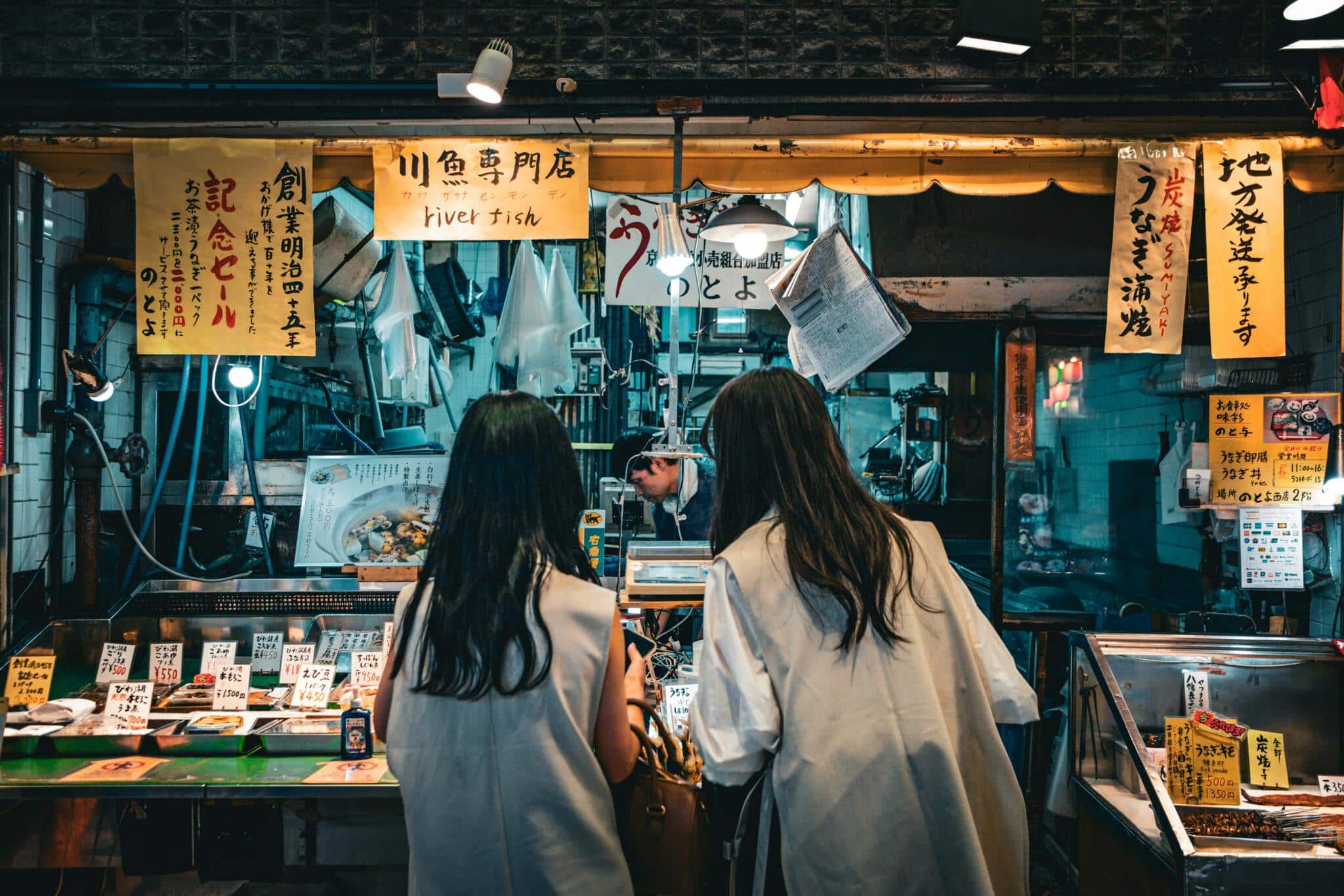 People at street vender in Tokyo, charity auction travel packages, vacation fundraising, travel fundraising, fundraising ideas, charity ideas, silent auction items, travel fundraising events